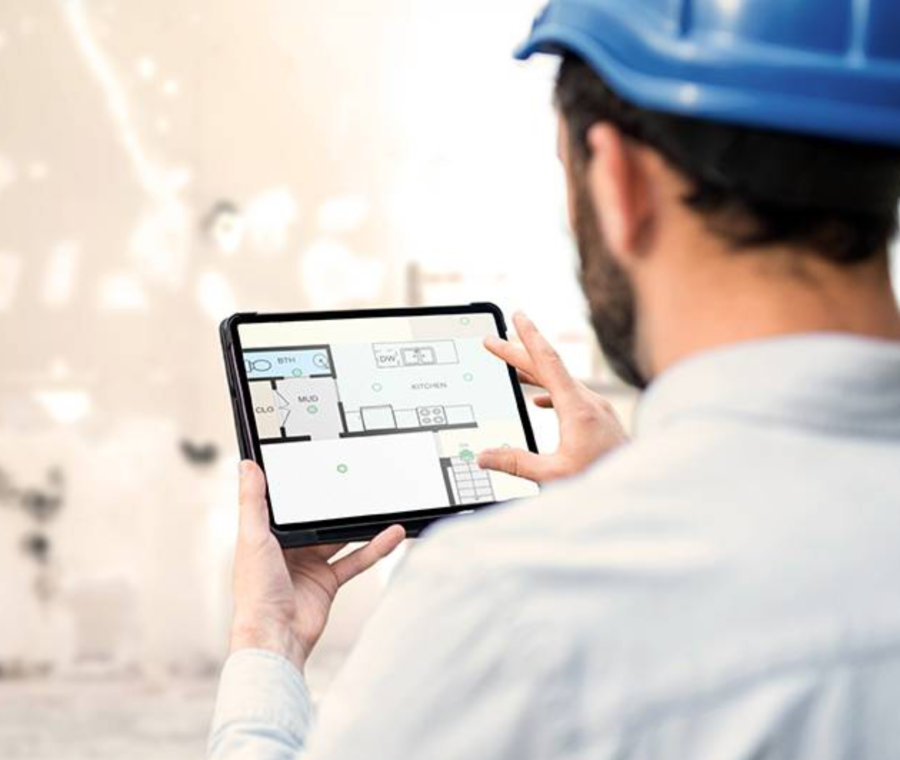 photo - Reviewing Floor Plans on Tablet